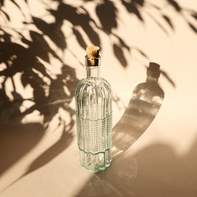 Декоративна циліндрична пляшка з прозорого скла