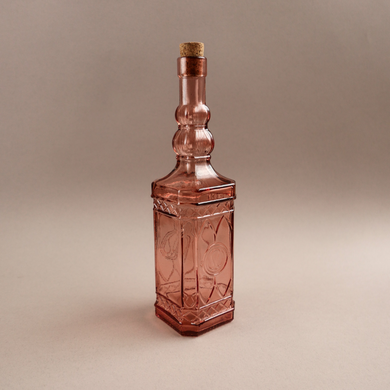 Декоративна пляшка з рожевого скла
