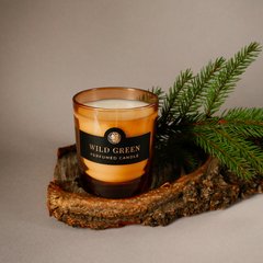 Парфумована свічка "Wild Green" у помаранчевій склянці
